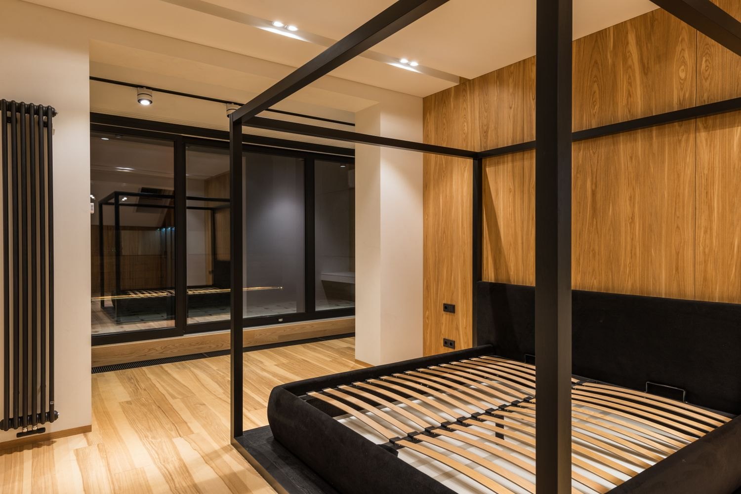 A bed frame without a mattress showing the wooden slats