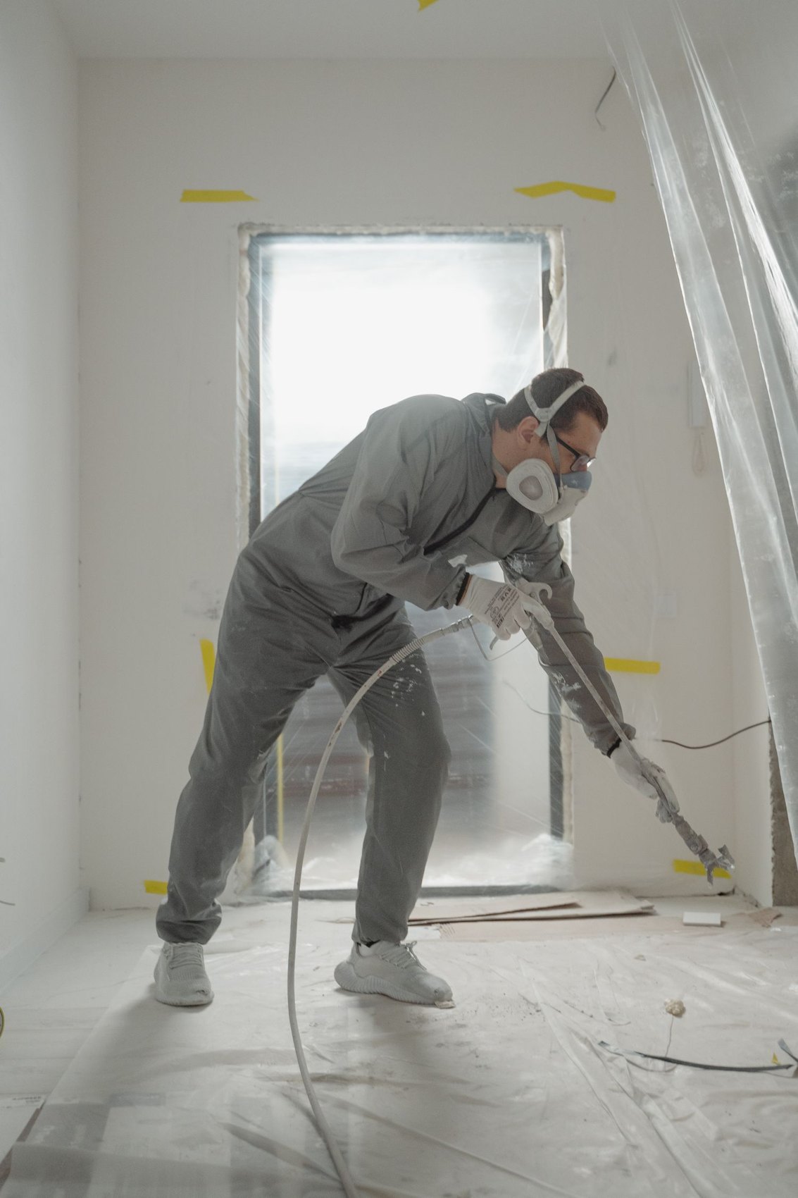A covered floor in a room during renovation work