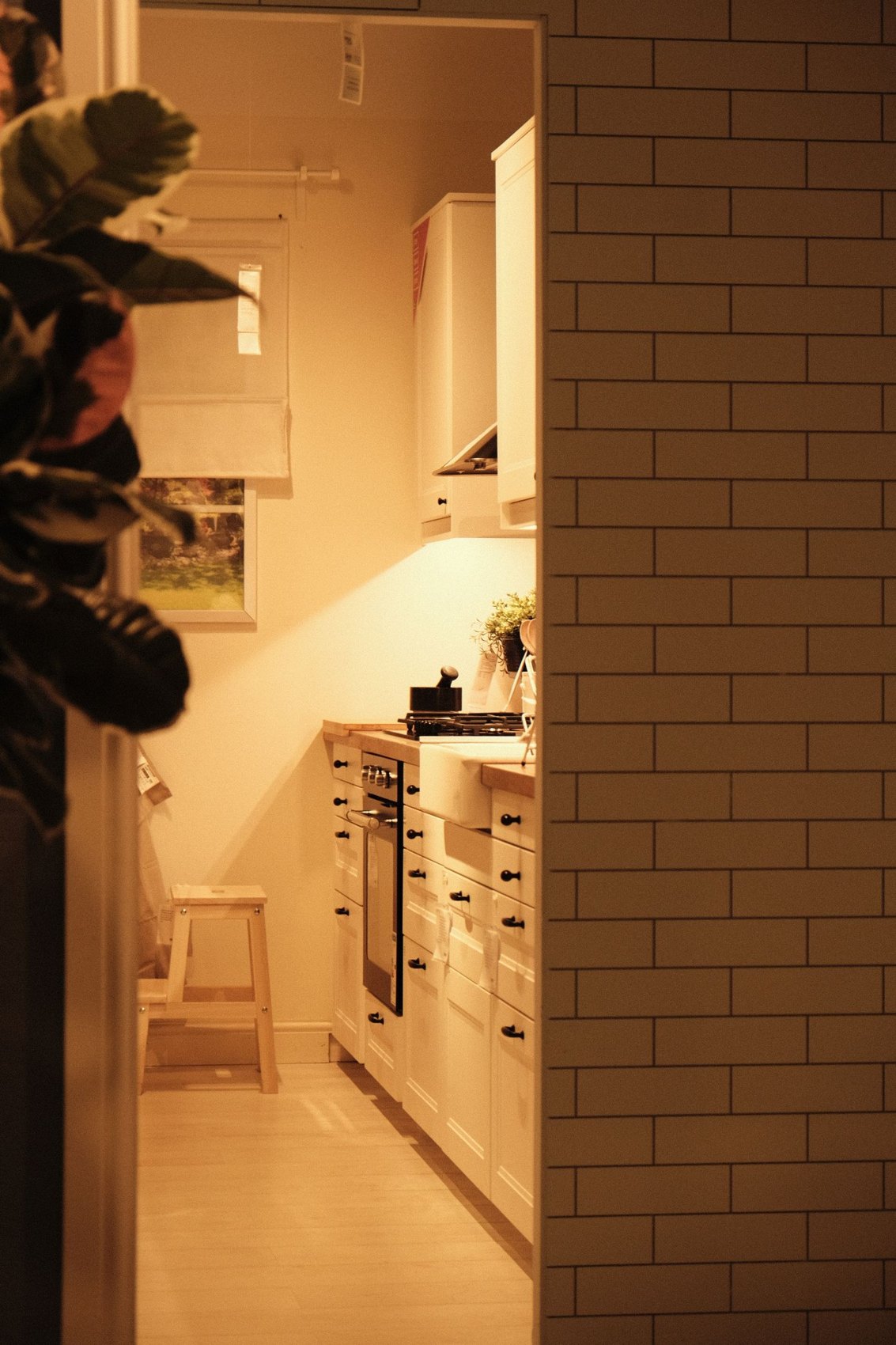 A compact kitchen with a light worktop