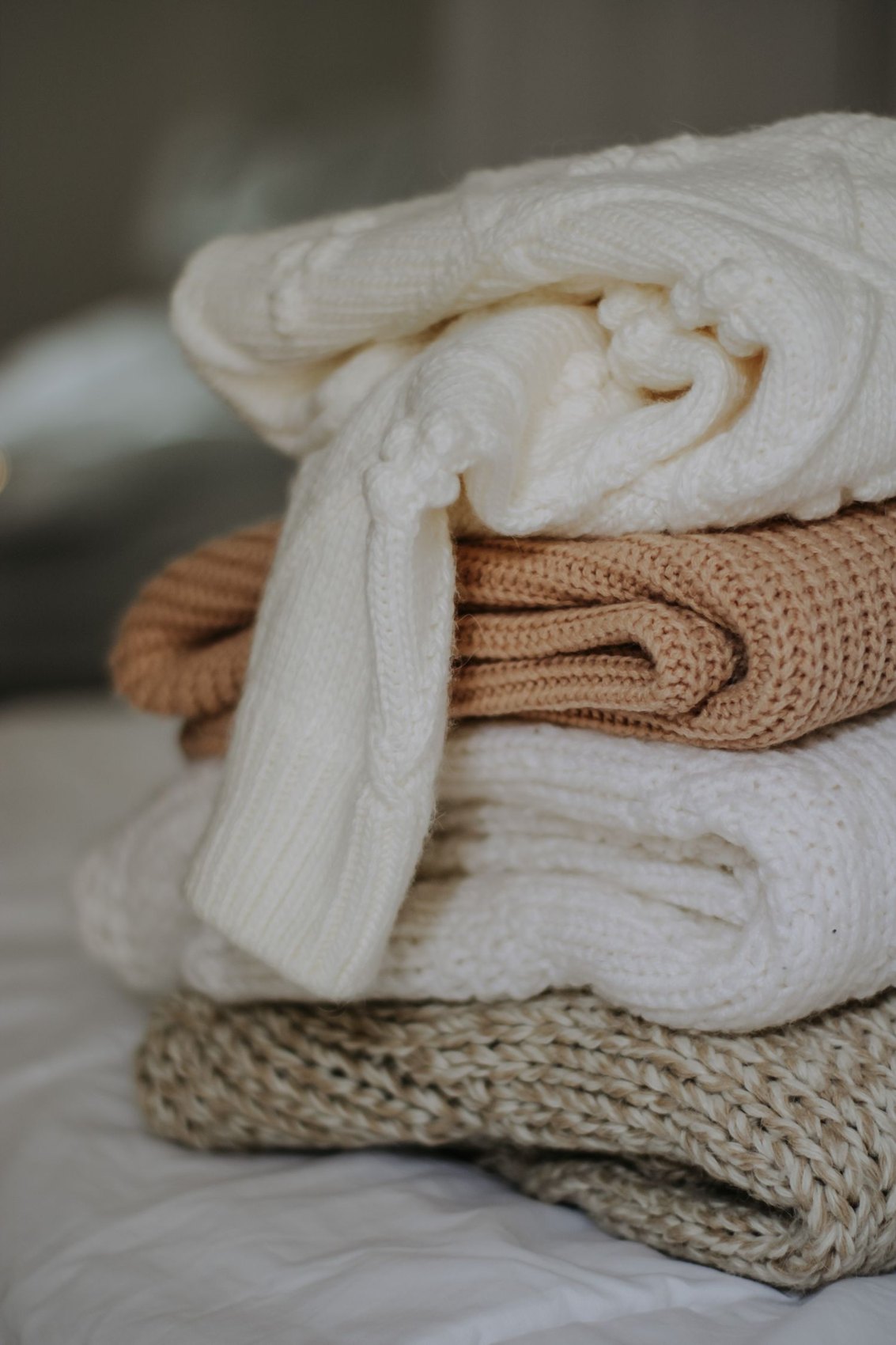 A stack of folded knitwear