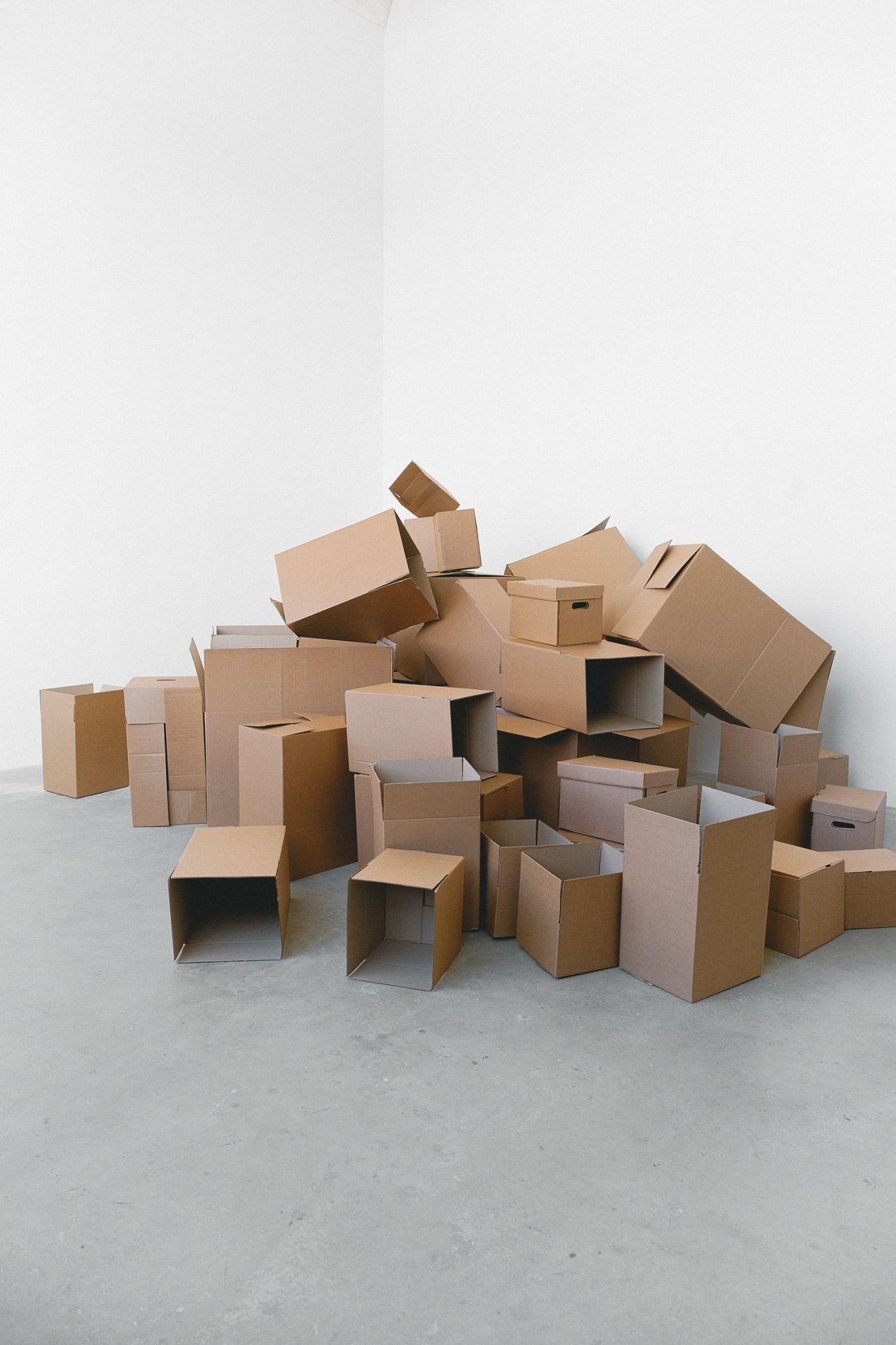 Boxes of different sizes in an empty room